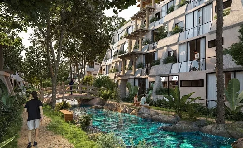 Residential Complex Tulum Aldea Zama side view from the bridge over water