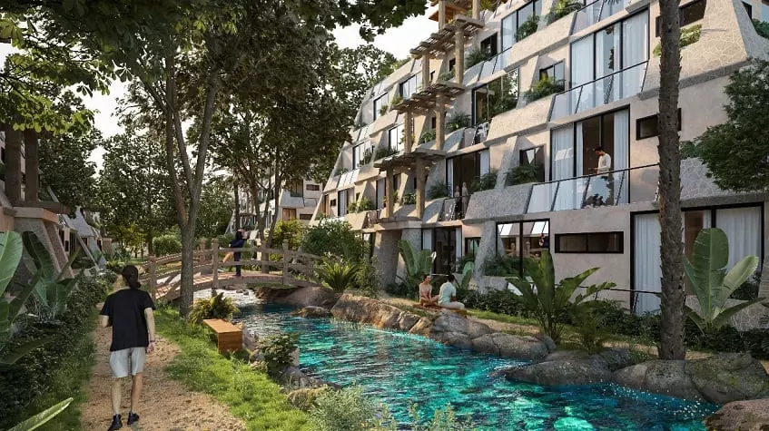 Residential Complex Tulum Aldea Zama side view from the bridge over water
